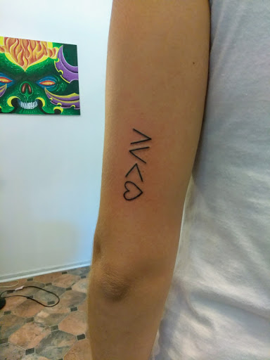 Explore olive branch tattoo ideas, creative tattoo ideas in Hebron, available at Explosive Ink Tattoo