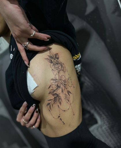 Explore large flower tattoo ideas, creative tattoo ideas in San Antonio, available at Firme Copias Tattoo Studio