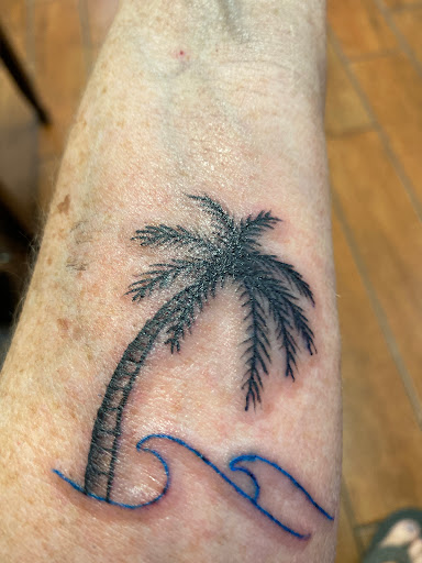 Explore back ear tattoo ideas, creative tattoo ideas in Stuart, available at Tiger Shark Tattoo Studio