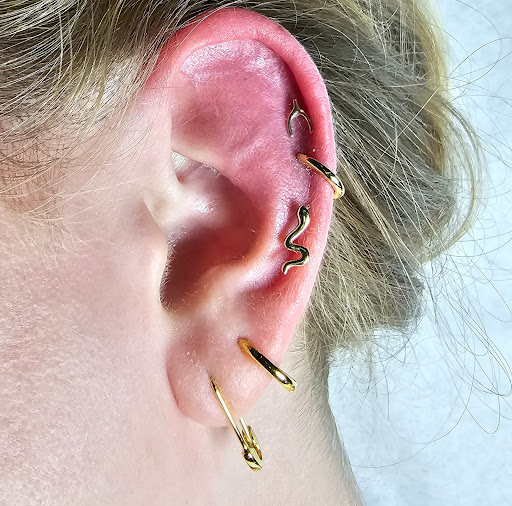 Explore inner ear tattoo ideas, creative tattoo ideas in San Diego, available at Sideshow Tattoo and Piercing