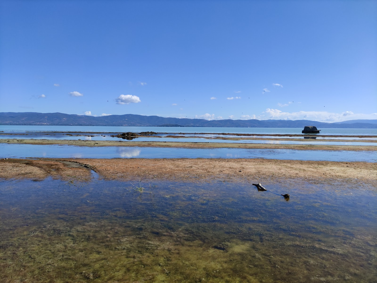 Foto av Sastiglione del lago spiaggia och bosättningen