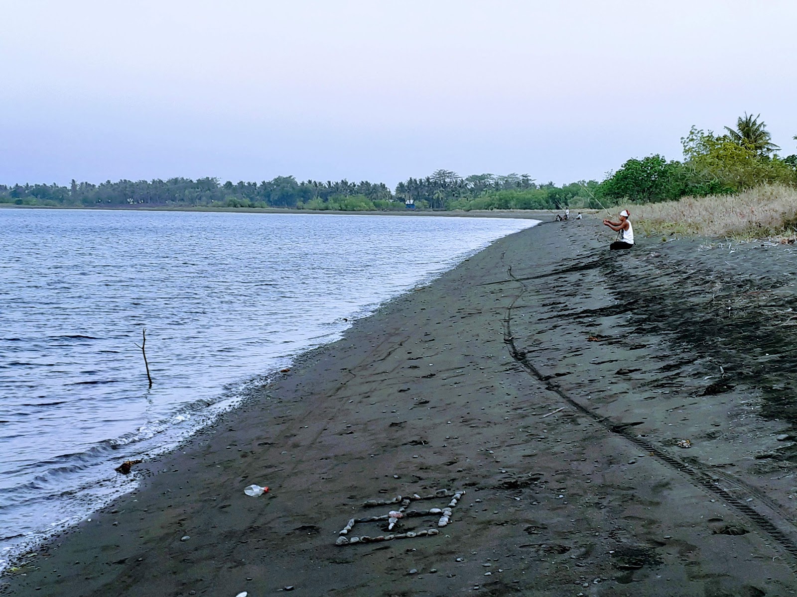 Foto de Dadap Hidden Beach con agua turquesa superficie