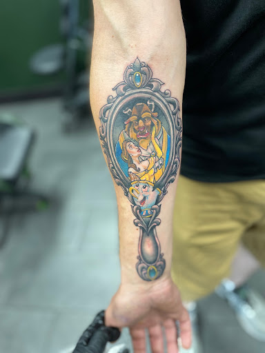 Find between breast tattoo ideas for your next unique tattoo in Summerville at Blackwater Tattoo Co.