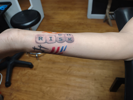 Explore matching husband and wife tattoo ideas, creative tattoo ideas in Williamston, available at Inkd Tattoo Parlor