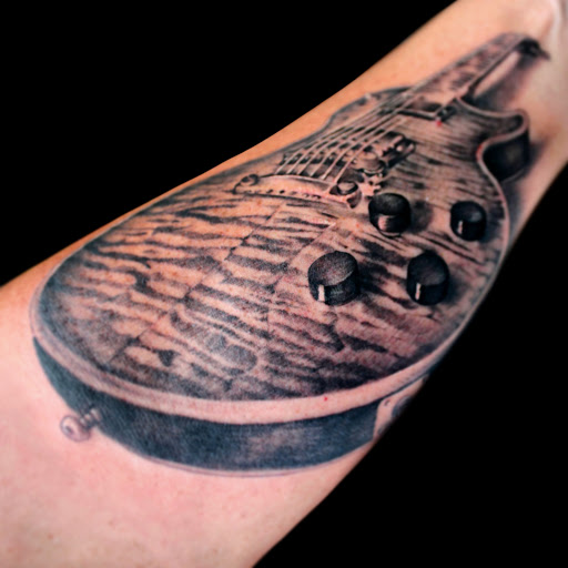 Find rib tattoo ideas for females for your next unique tattoo in Riverview at 9-Line Tattoo