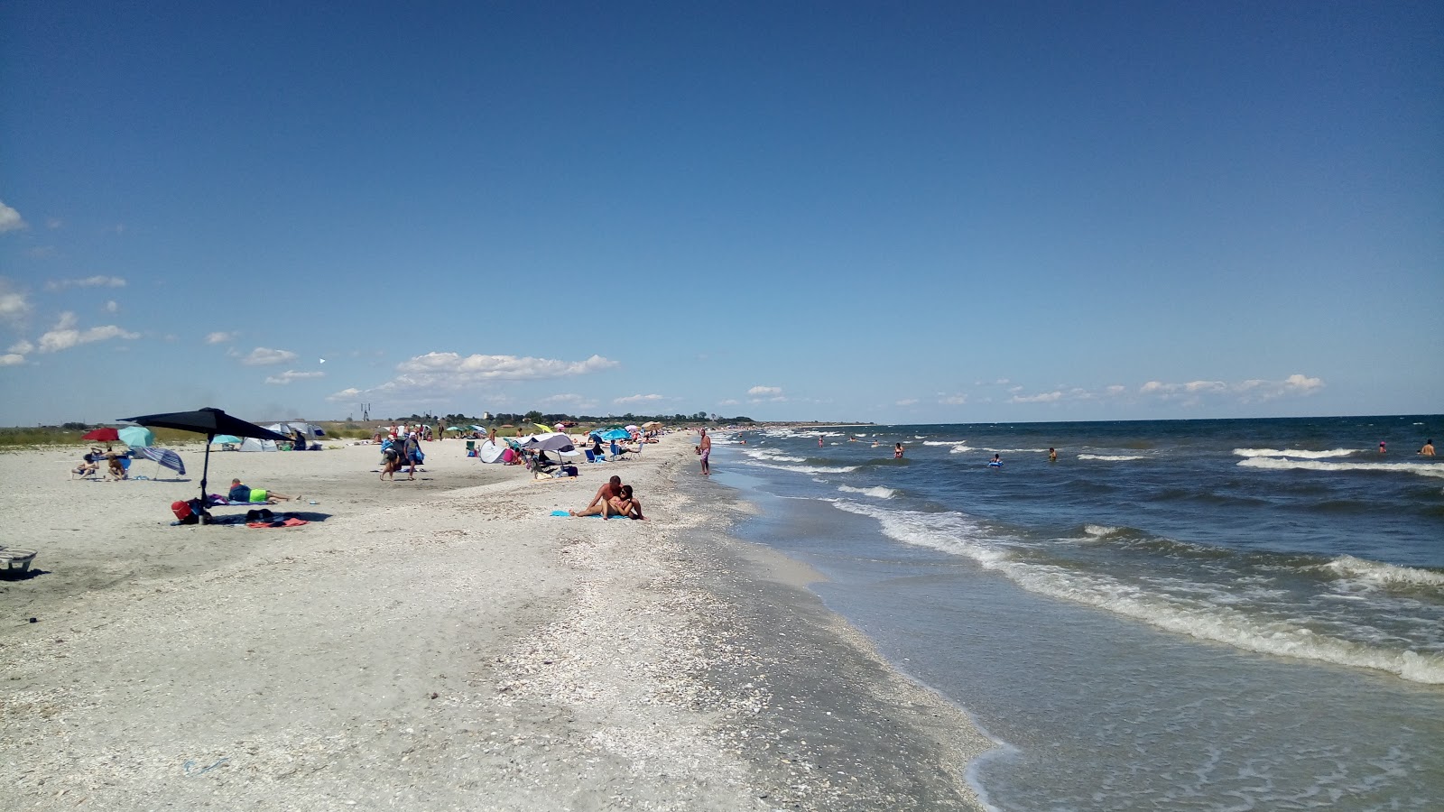 Foto di Corbu beach con una superficie del sabbia beige