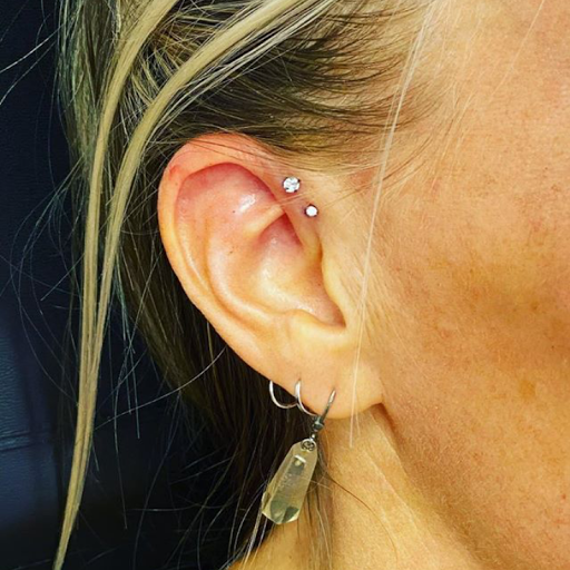 Explore green arrow tattoo ideas, creative tattoo ideas in Aledo, available at Elevated Tattoo & Piercing