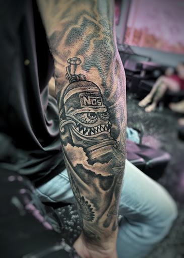 Explore red ink tattoo ideas, creative tattoo ideas in Fort Myers, available at Loyal 2 The Coil Tattoos & Piercings (Edison Mall Location Entrance F)