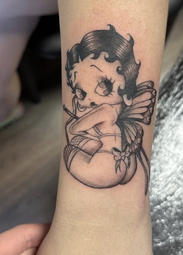 Explore lily tattoo ideas, creative tattoo ideas in Houston, available at 333 Tattoo Studio HTX