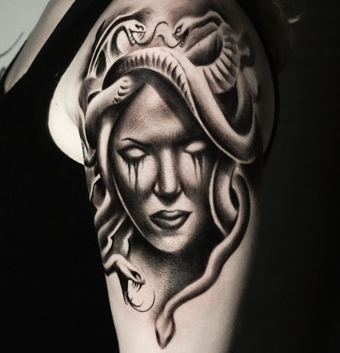 Explore bull riding tattoo ideas, creative tattoo ideas in Fayetteville, available at Sacred Raven Tattoo Shop