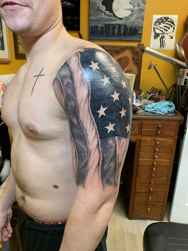 Explore dirt bike tattoos ideas, creative tattoo ideas in Brunswick, available at Blue Fin Tattoos