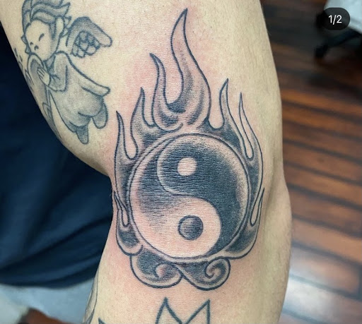 Explore tattoo cover up ideas on forearm, creative tattoo ideas in Baltimore, available at Rippd Canvas Tattoo Shop Artists Social Club