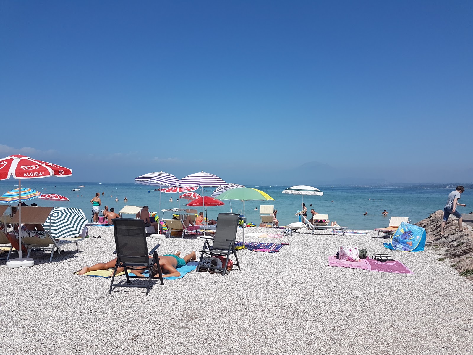Spiaggia Dei Capuccini的照片 带有碧绿色水表面