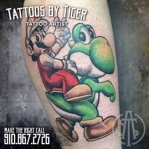 Explore word finger tattoo ideas, creative tattoo ideas in Fayetteville, available at American Tattoo Society of Fayetteville