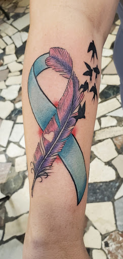 Explore half heart tattoo ideas, creative tattoo ideas in New Orleans, available at Downtown Tattoos and Piercing