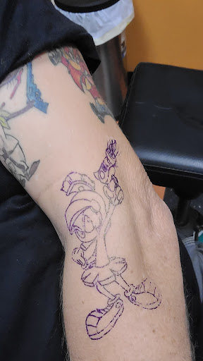 Explore lion forearm tattoo ideas, creative tattoo ideas in Marion, available at Peezys Tattoos & Body Piercings