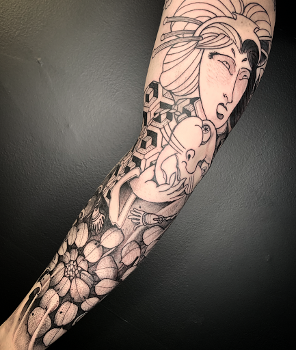 Explore guitar pick tattoo ideas, creative tattoo ideas in Winter Park, available at Golden Tarot Ink Club