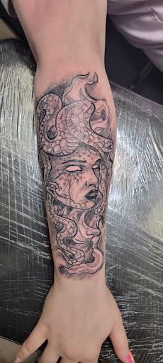 Explore haunted mansion tattoo ideas, creative tattoo ideas in Conway, available at Primal Urge Tattoos