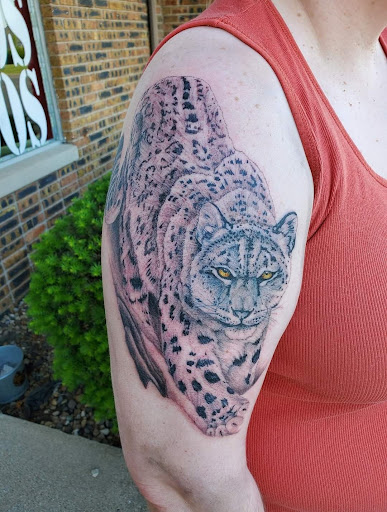 Explore mothman tattoo ideas, creative tattoo ideas in Peoria, available at Guerrilla Ink Tattoos