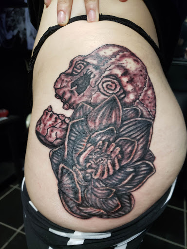 Explore ectopic pregnancy tattoo ideas, creative tattoo ideas in Erie, available at EliKingInk