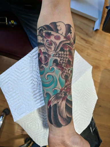 Explore thigh tattoo ideas for females, creative tattoo ideas in New Hartford, available at Bodily Charm Tattoo & Piercing