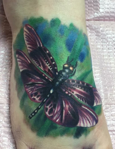Explore watercolor flower tattoo ideas, creative tattoo ideas in Jacksonville, available at Electric Legacy Tattoo