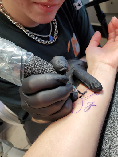 Explore back hand tattoo ideas, creative tattoo ideas in Ocoee, available at Slaughterized Ink Tattoo and Piercing Studio