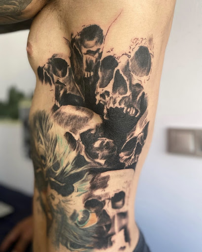 Explore tattoo ideas for buttocks, creative tattoo ideas in Washington, available at Trilogy Atelier - DC Tattoo Shop Piercing Studio