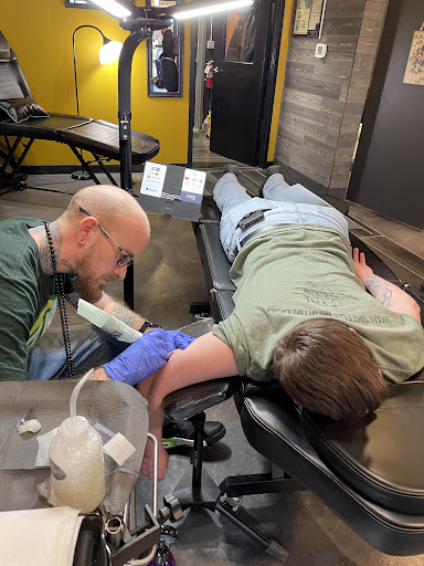 Explore men's behind the ear tattoo ideas, creative tattoo ideas in Greenwood, available at Vault 74 Tattoo, LLC