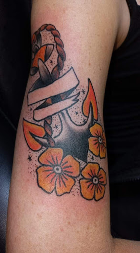 Explore diving tattoo ideas, creative tattoo ideas in Angola, available at Hoodlum Ink