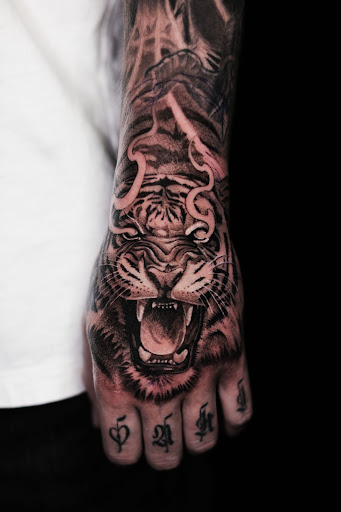 Explore joker tattoo ideas for guys, creative tattoo ideas in Norcross, available at Brotherhood Tattoo