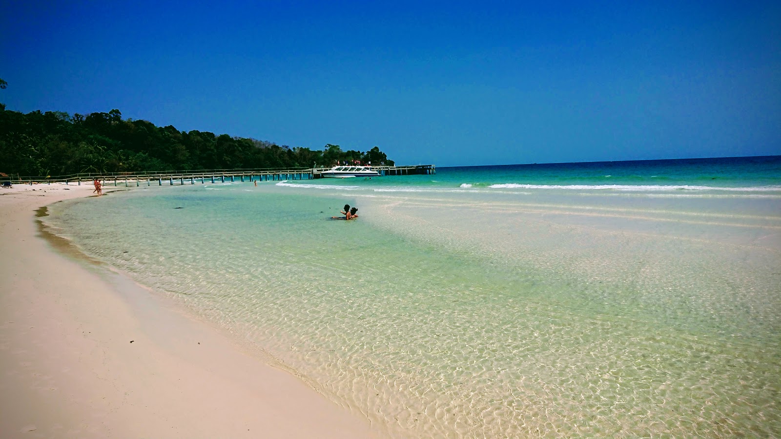 Fotografija Coconut Beach z turkizna čista voda površino