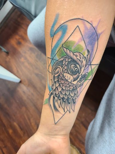 Explore memorial cross tattoo ideas, creative tattoo ideas in Powell, available at Against All Odds Tattoos and Piercings