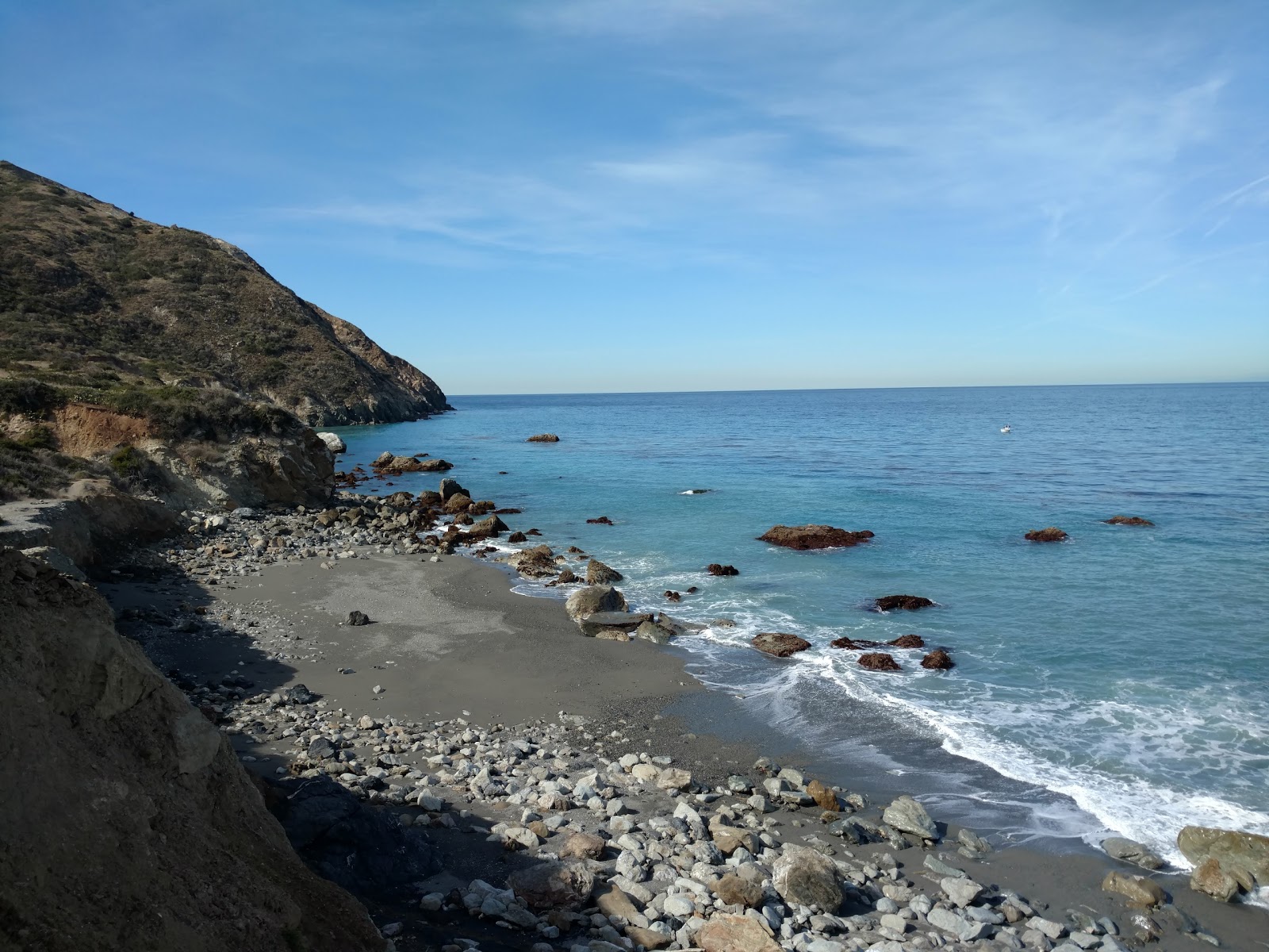 Foto di Starlight Beach con una superficie del sabbia con pietre