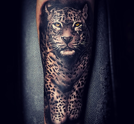 Explore dominican flag tattoo ideas, creative tattoo ideas in Clovis, available at High Sierra Tattoo Co.