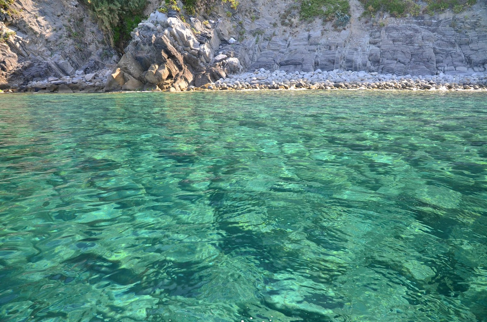 Foto von Spiaggia del Nacche wilde gegend