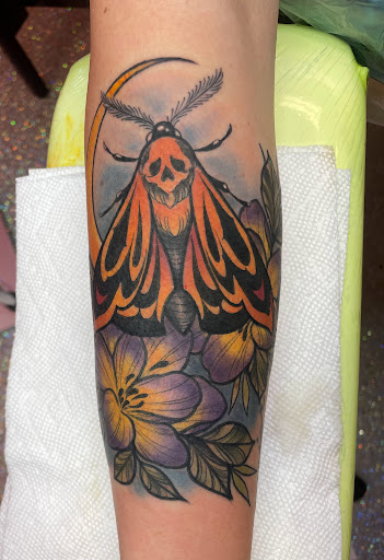 Explore blackout cover up tattoo ideas, creative tattoo ideas in Houston, available at The Neon Jackal Tattoo