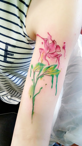 Explore lower half sleeve tattoo ideas for females, creative tattoo ideas in Sandwich, available at Family Pride Tattooing and Piercing