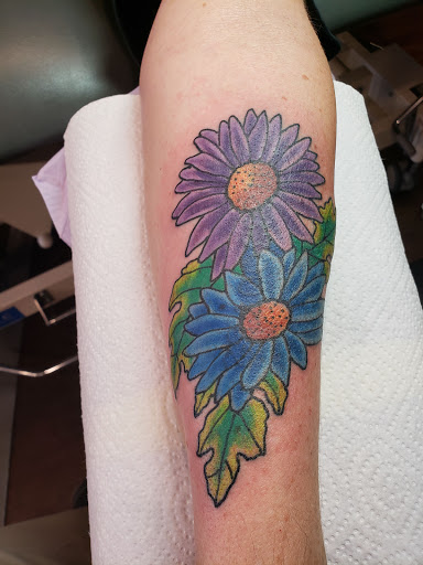 Explore eye tattoo ideas for guys, creative tattoo ideas in Omaha, available at Sailors Grave Tattoo