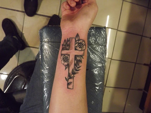 Explore red ink neck tattoo ideas, creative tattoo ideas in Princeton, available at Custom Dreams Tattooing and Body Piercing