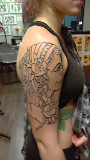 Explore mental health ribbon tattoo ideas, creative tattoo ideas in Fort Wayne, available at Grade A Tattoos and Body Piercing