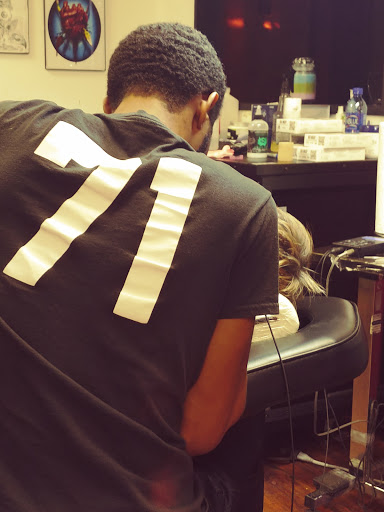 Explore athletic tattoo ideas, creative tattoo ideas in Ottumwa, available at Family Tradition TattoosPiercings