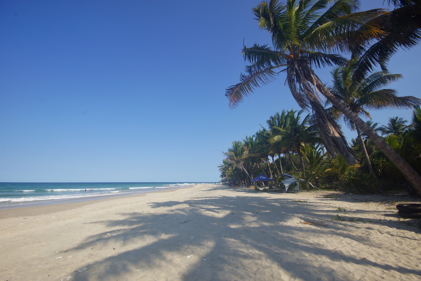 Foto van Praia Morrungulo met helder zand oppervlakte