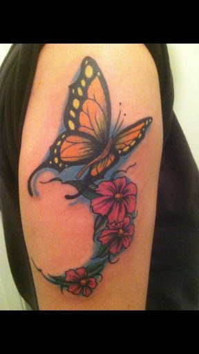 Find flower thigh tattoo ideas for your next unique tattoo in Sacramento at 13 MAG TATTOO