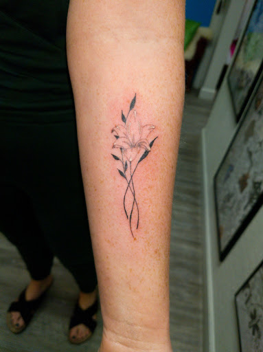 Explore front thigh tattoo ideas for women, creative tattoo ideas in Jonesboro, available at Immortal Ink