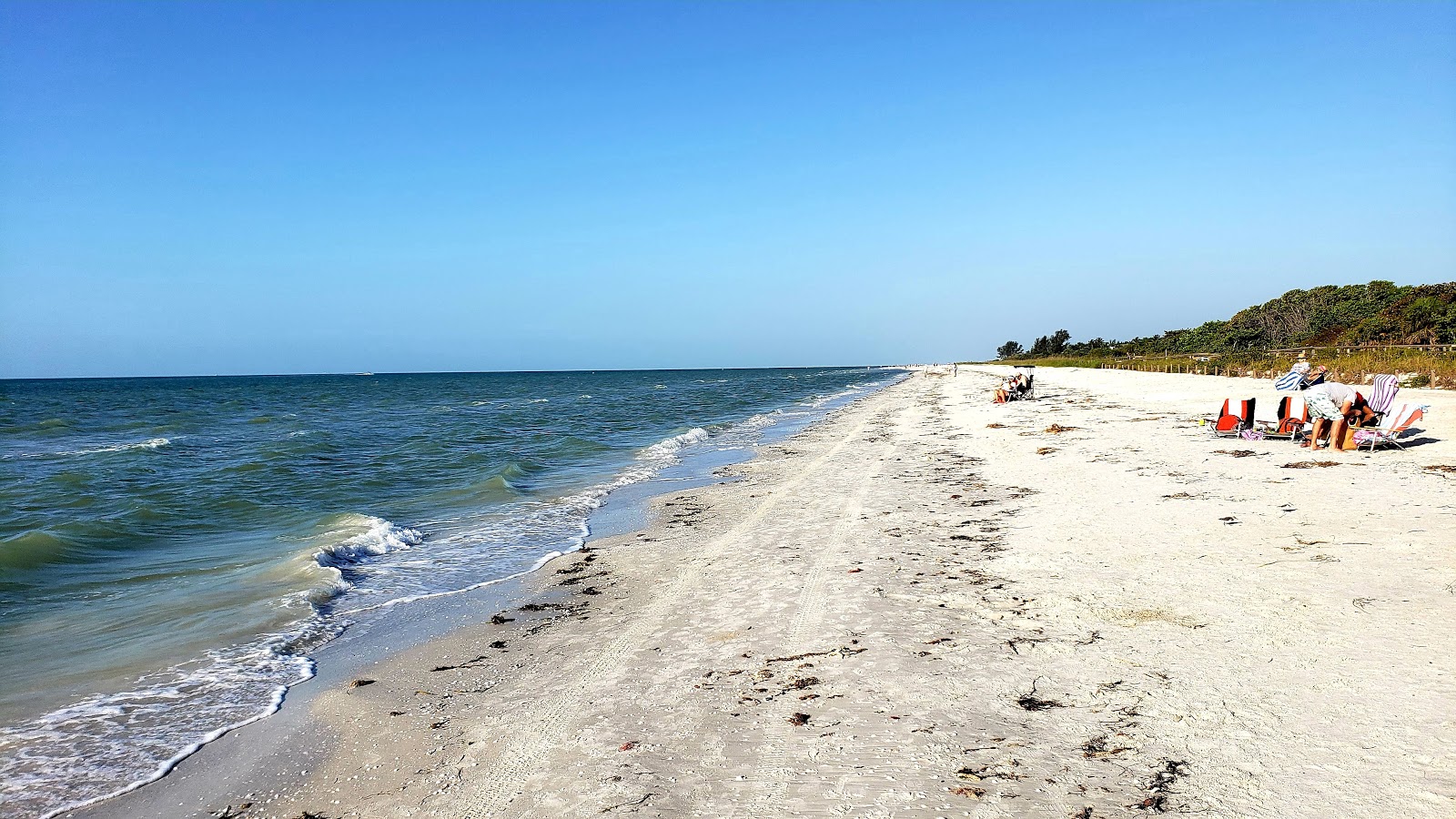 Foto de Lighthouse beach com linha costeira longa e reta