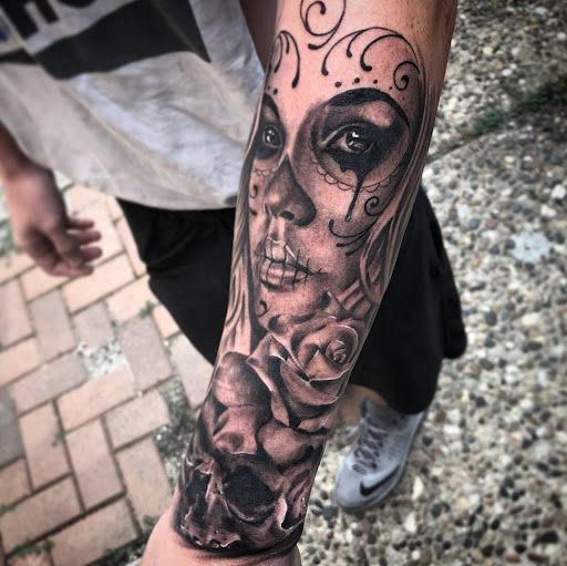 Explore tribal wolf tattoo ideas, creative tattoo ideas in Cedar Falls, available at The Iron Quill Tattoo Parlor