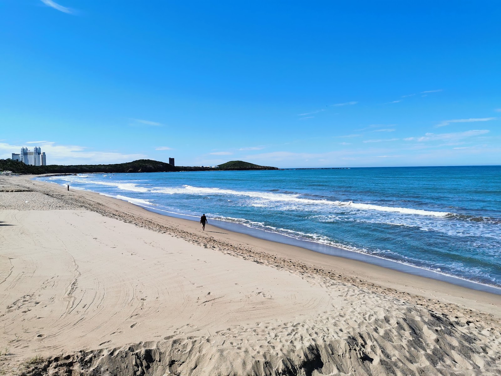 Fotografija La Escopama beach z svetel pesek površino