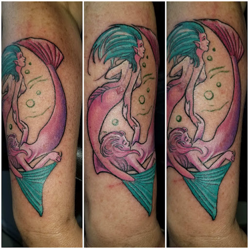 Explore tattoo ideas for side of stomach, creative tattoo ideas in Angola, available at Hoodlum Ink