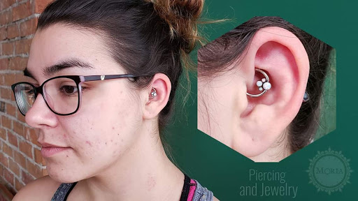 Explore tattoo ideas on the thigh, creative tattoo ideas in Buffalo, available at Moria Piercing and Jewelry